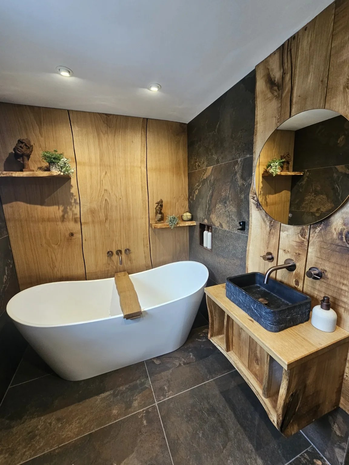 Complete bespoke bathroom joinery with oak wall panels and vanity